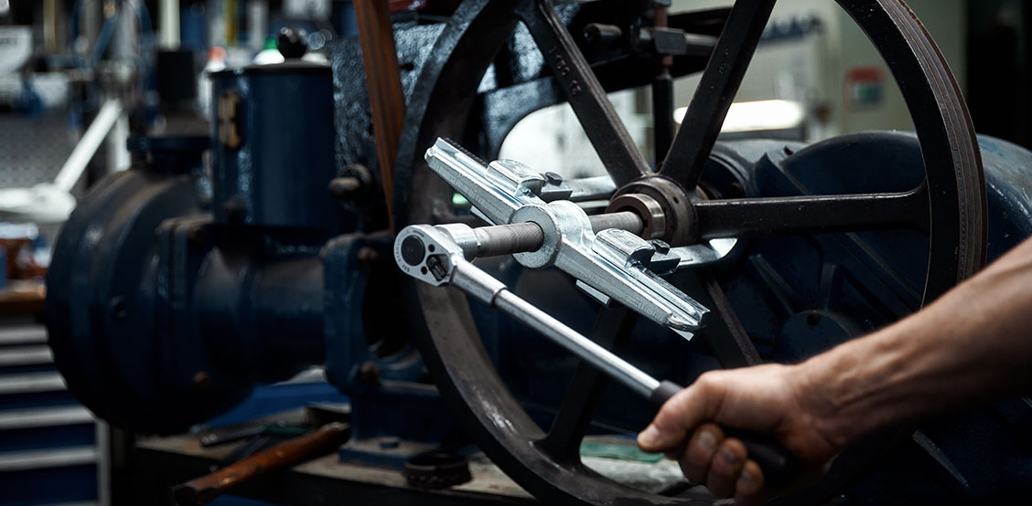A work spotlight is on a workbench